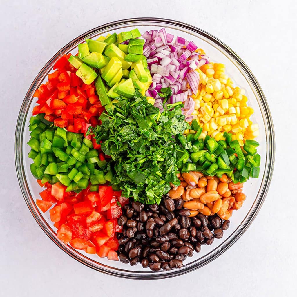 overhead shot of a colorful bowl of vegetables ready to make dip.