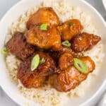 overhead shot of firecracker chicken over white rice.