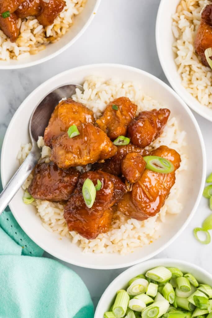 overhead shot of firecracker chicken on white rice.