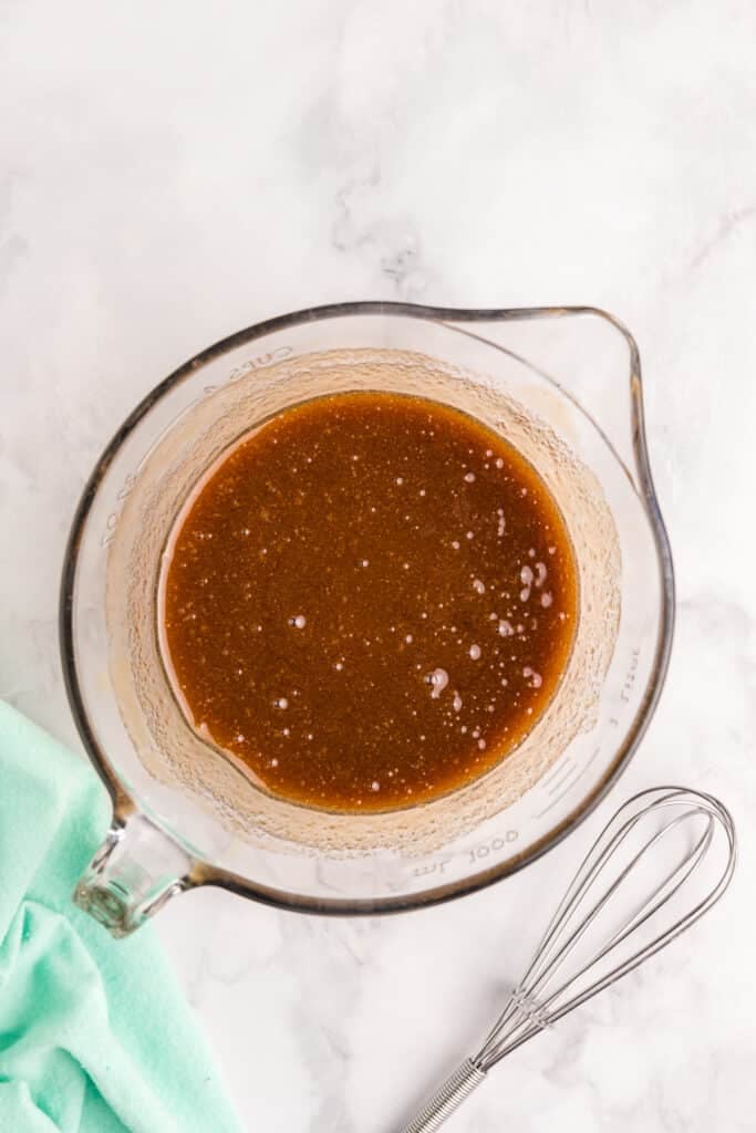 overhead shot of sauce in a measuring cup.
