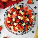 overhead shot of a bowl of fruit salad with apple stars.
