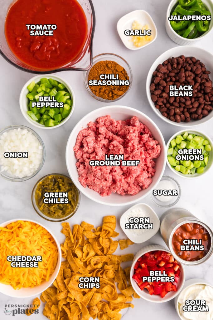 overhead shot of labeled ingredients laid out to make frito pie.