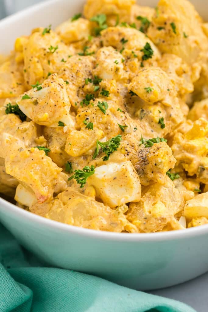 closeup of a bowl of deviled egg potato salad.