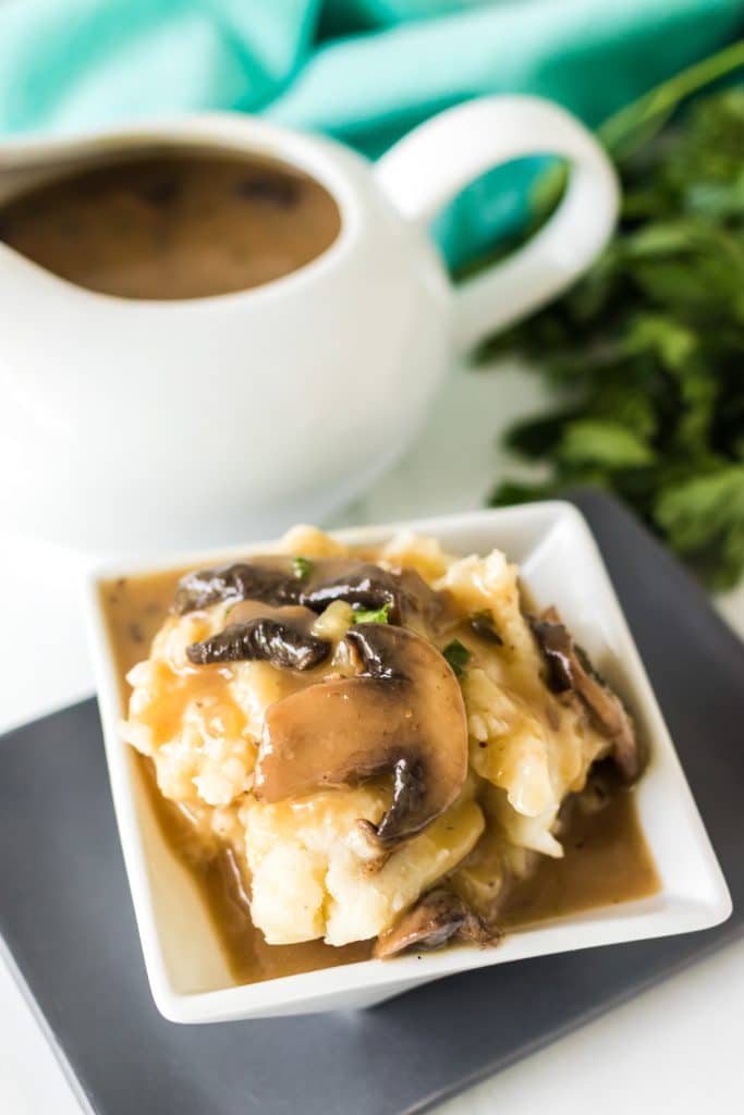 mushroom gravy on a bowl of mashed potatoes.
