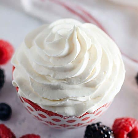 bowl of homemade cool whip piped into a swirl.