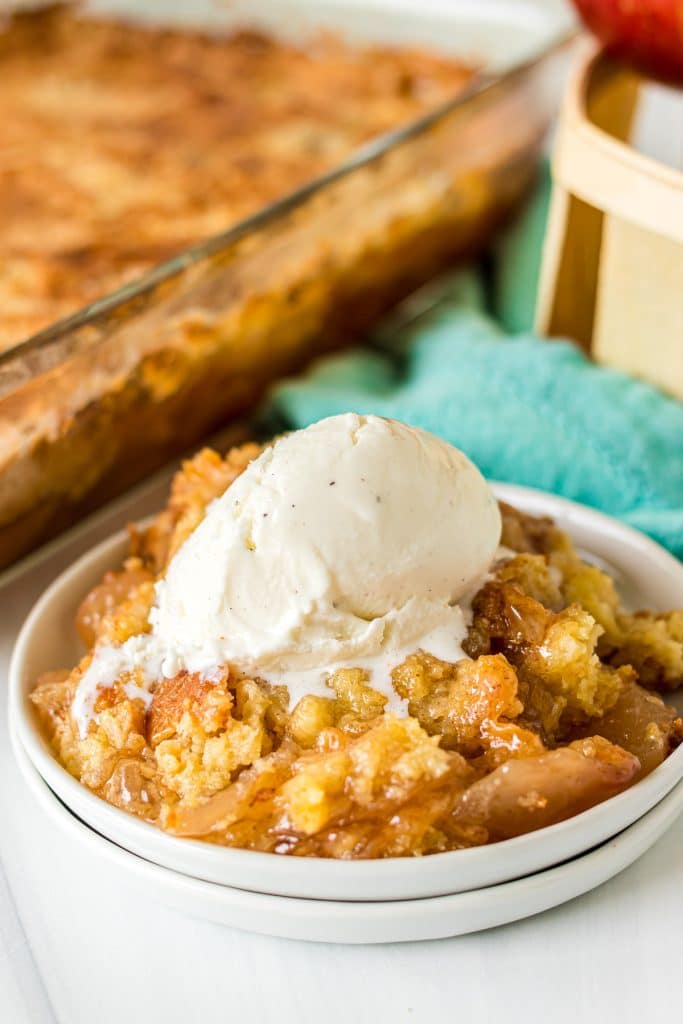 apple dump cake topped with vanilla ice cream.