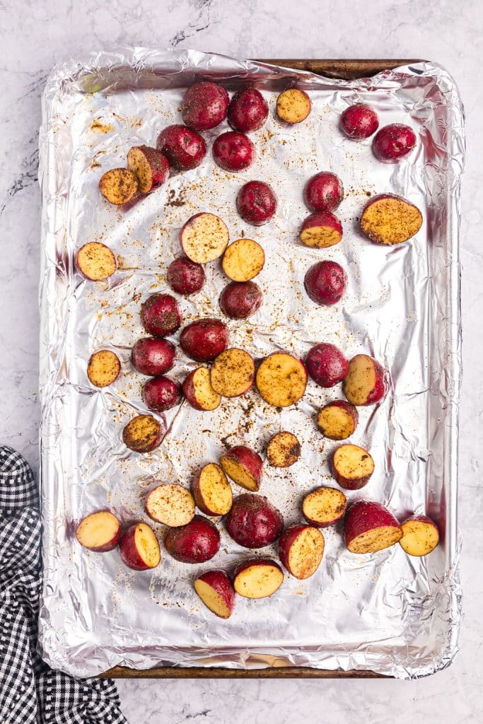 overhead shot of potatoes on a baking sheet.
