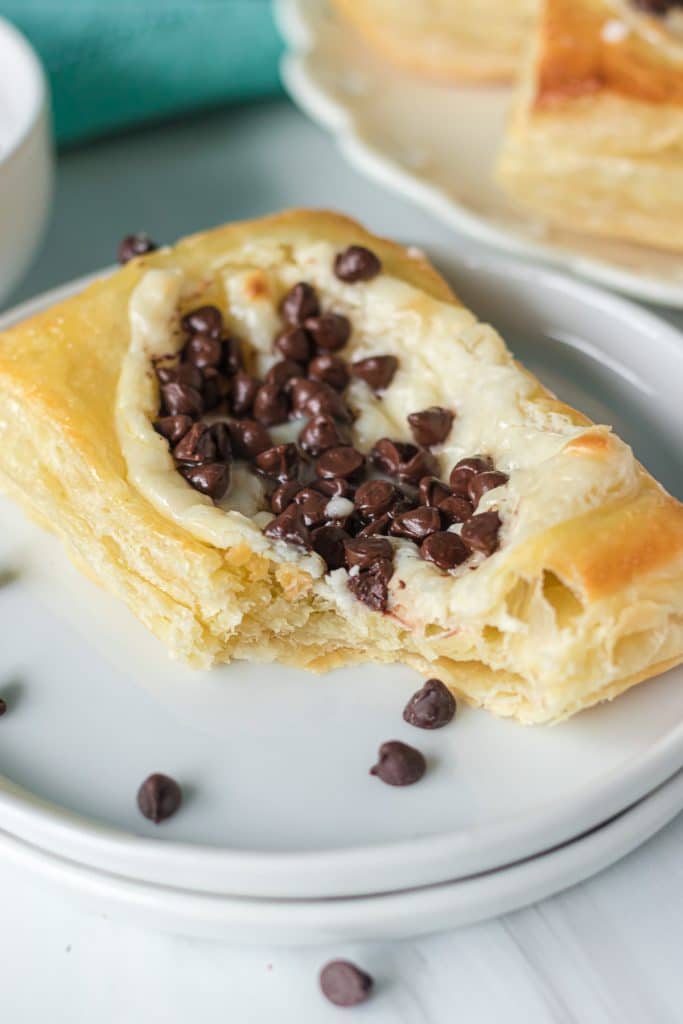 chocolate chip cream cheese danish with a bite missing.