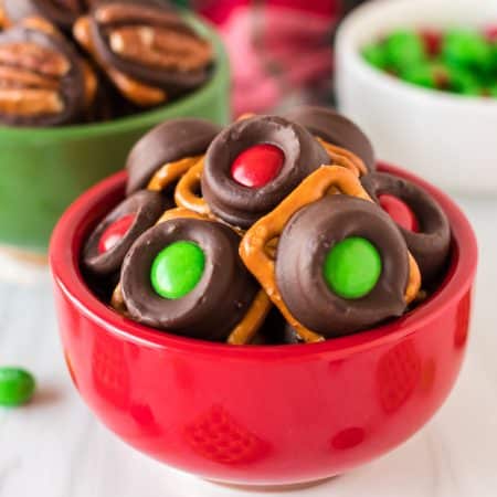 red bowl filled with christmas rolo pretzels.
