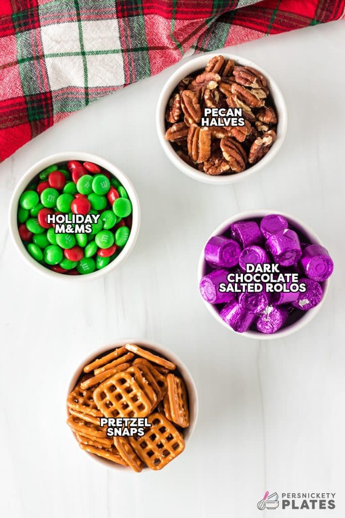 overhead shot of labeled ingredients laid out to make rolo pretzels.