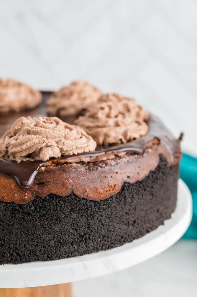 side view of a triple chocolate cheesecake.