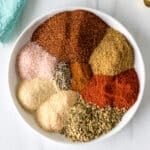 seasonings on a plate to make a homemade chili seasoning blend.