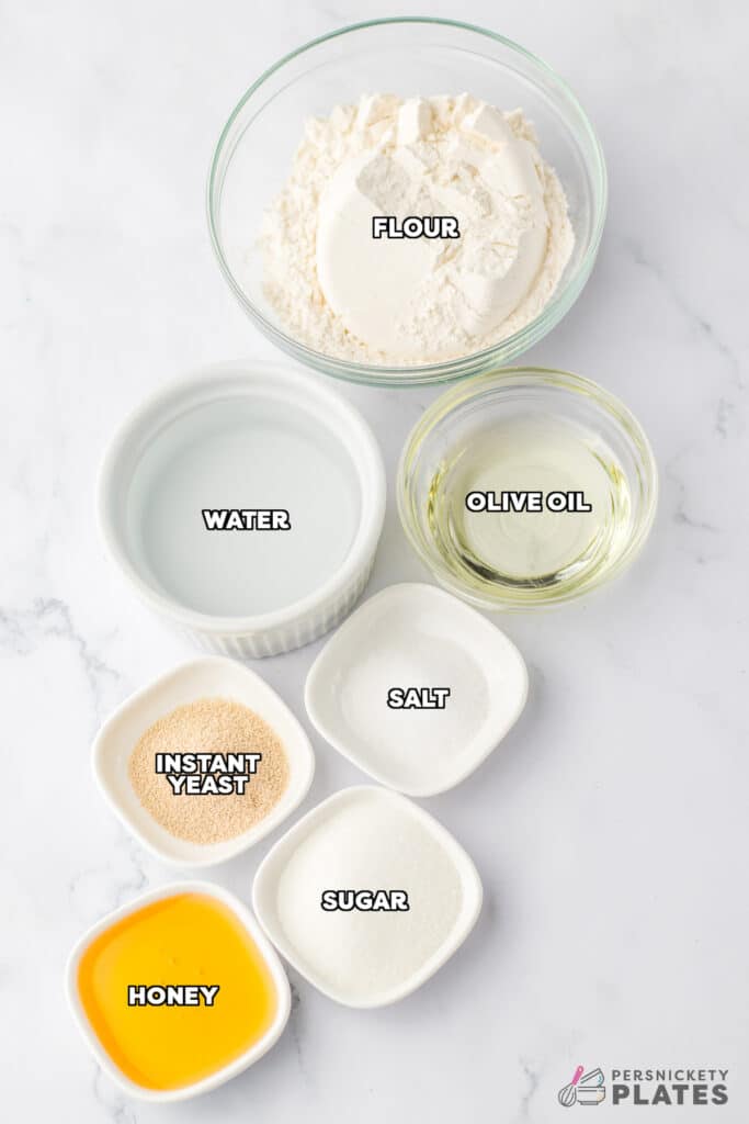 overhead shot of labeled ingredients laid out to make crockpot bread.