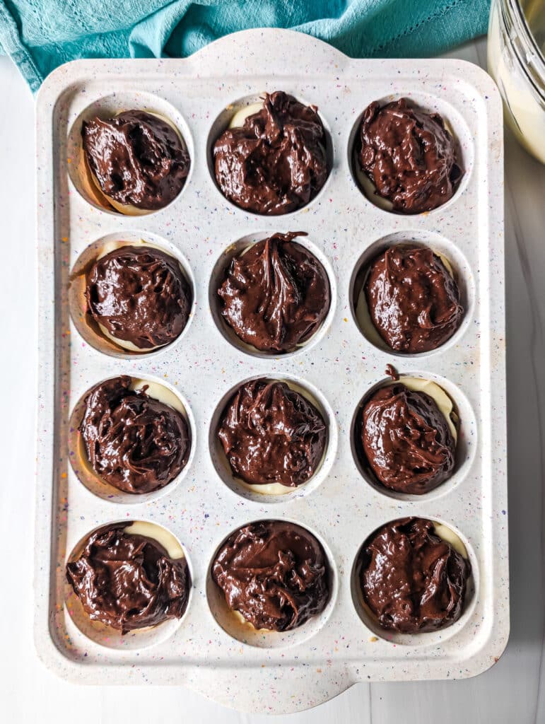 overhead shot of brownie batter in a cupcake pan.