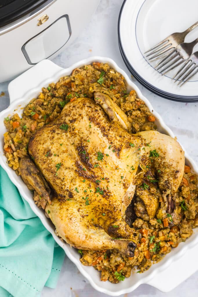 platter of roasted chicken on stuffing.