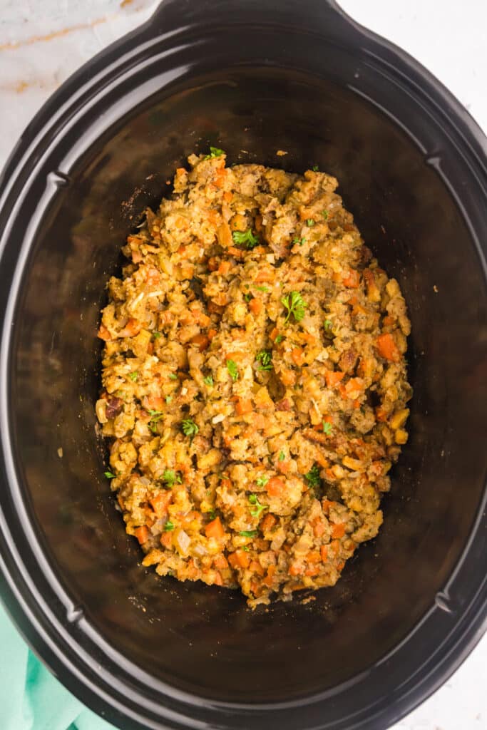 overhead shot of prepared stuffing in a crockpot.
