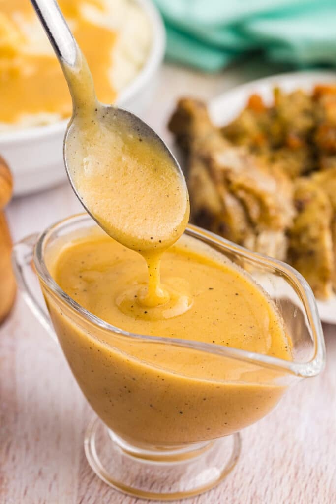 chicken gravy in a glass gravy boat.