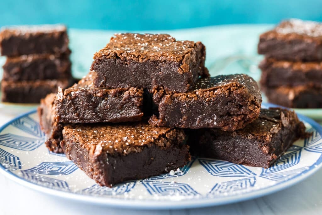 pile of brownies on a plate.