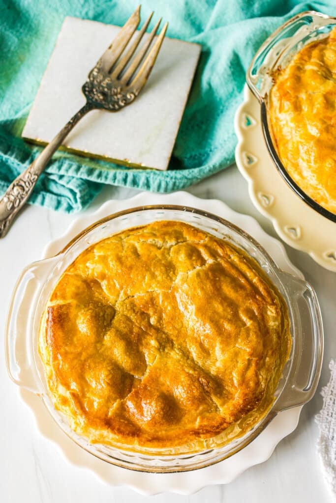 overhead shot of a chicken pot pie with a serving fork.