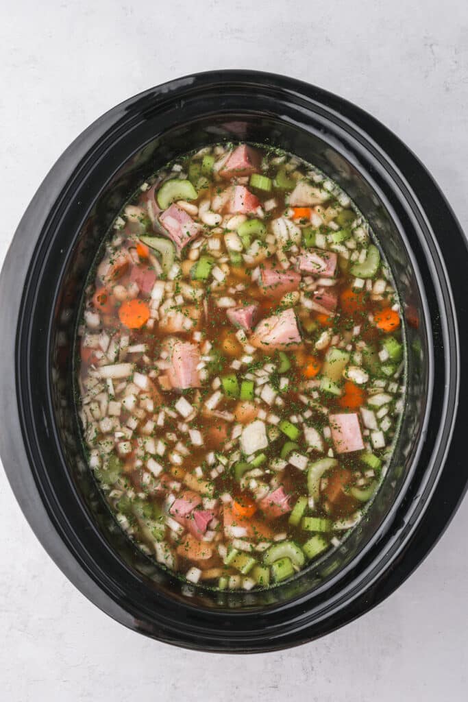 ham and bean soup in a crockpot before cooking.