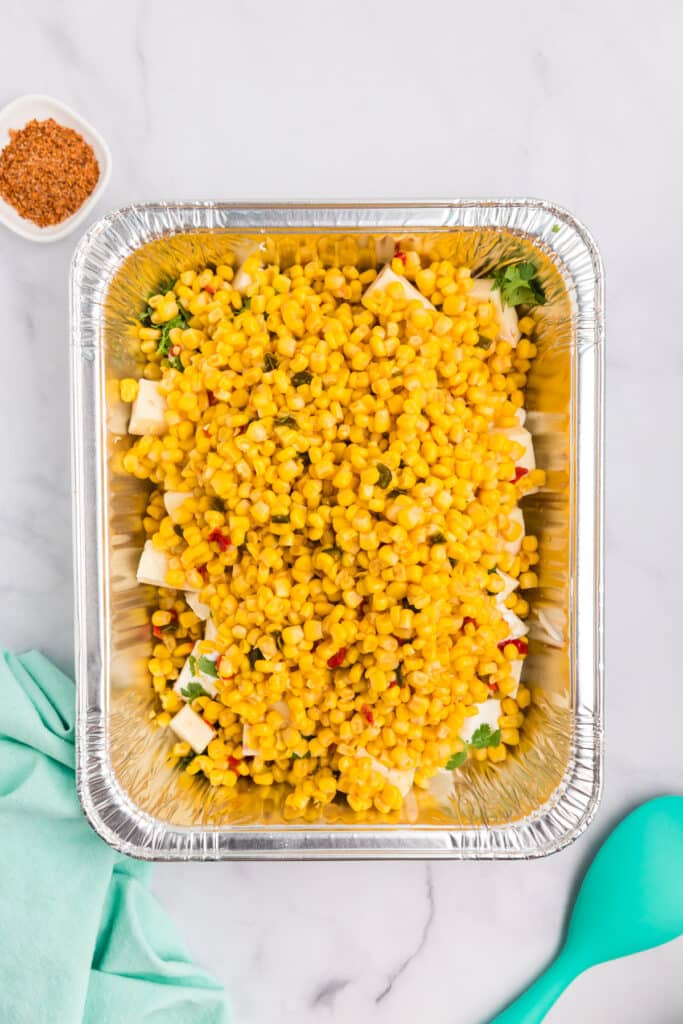 corn kernels in an aluminum pan.