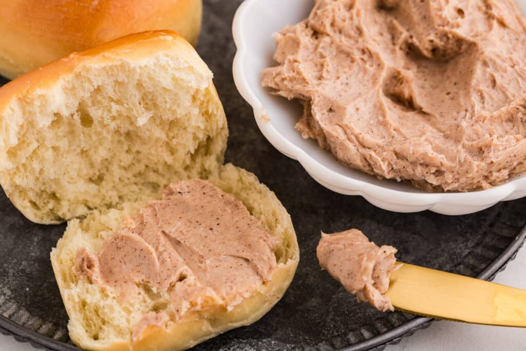 cinnamon honey butter spread on a roll.