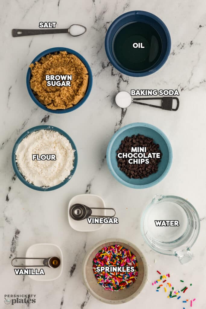 overhead shot of labeled ingredients laid out to make a sprinkle snack cake.