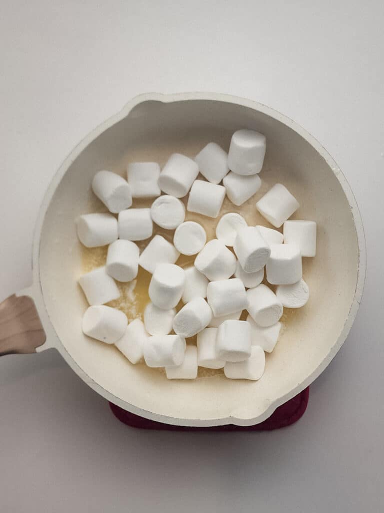 A saucepan filled with marshmallows and melted butter.