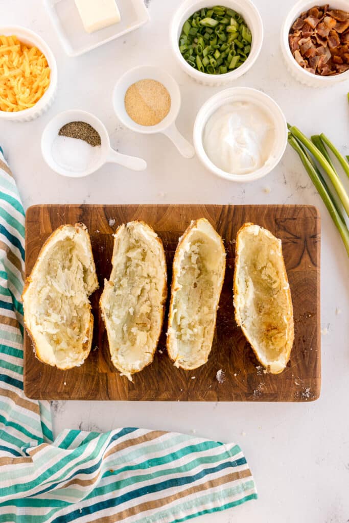 sliced potatoes with the insides scraped out.