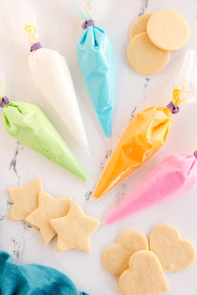 Piping bags filled with colorful icing.