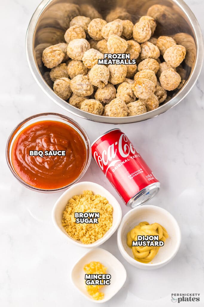 Ingredients laid out to make Coca-Cola meatballs in bowls.