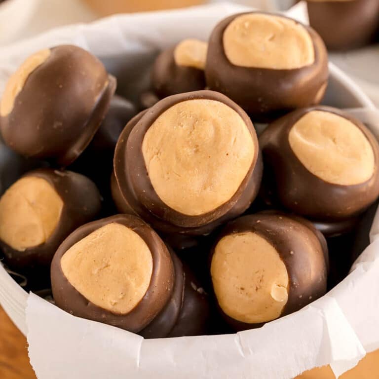 A bowl filled with chocolate-dipped peanut butter buckeye balls.