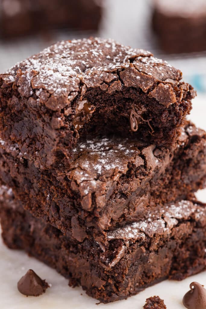 Stack of fudgy chocolate brownies with a melted chocolate center.