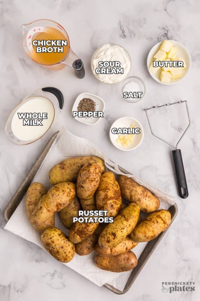 Ingredients for slow cooker mashed potatoes arranged on a counter.
